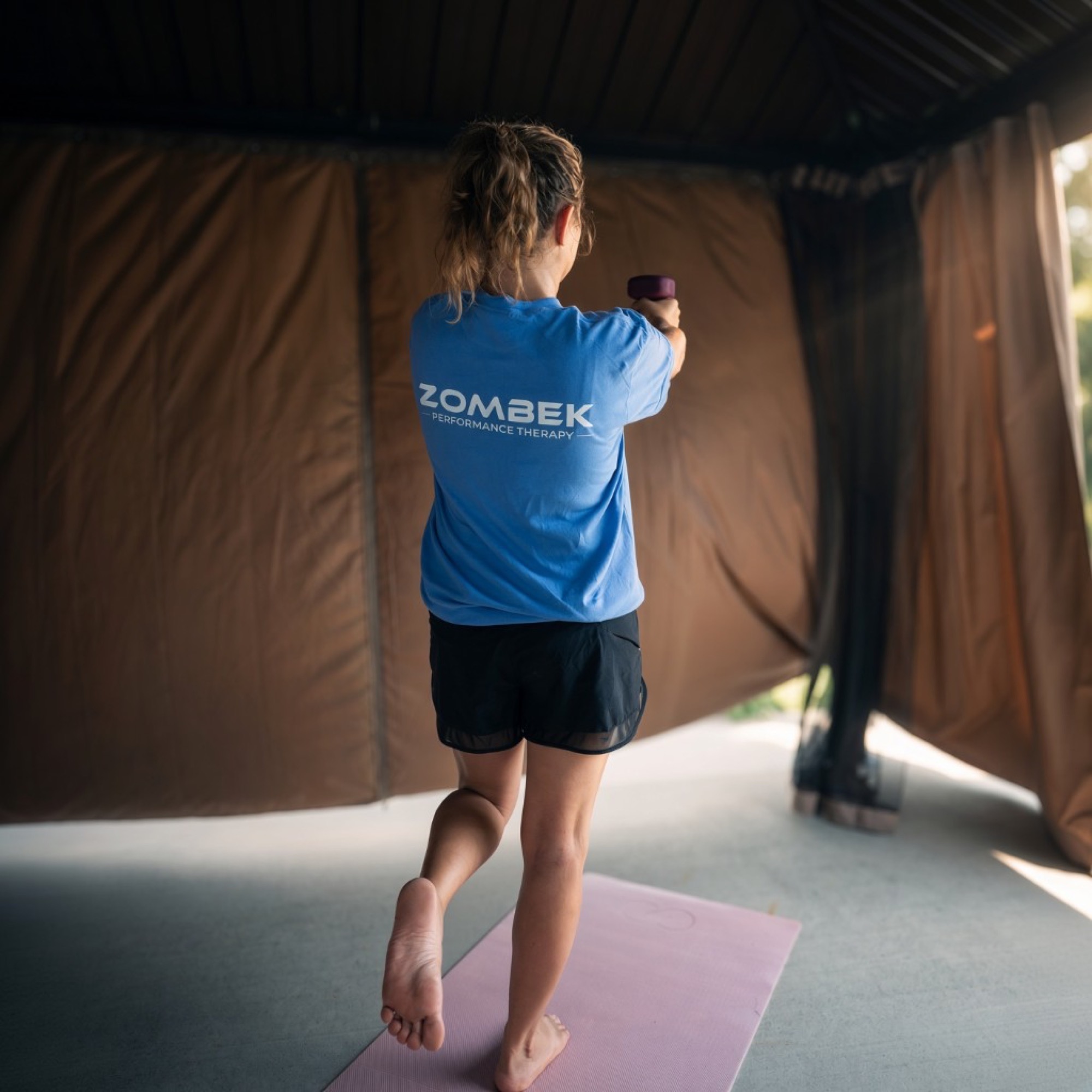 Zombek Performance Therapy logo on clinic apparel
