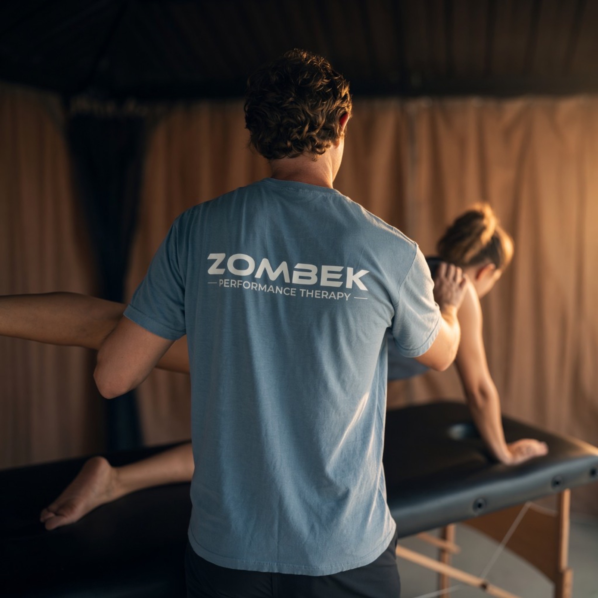 Dr. Zombek treating a patient at Zombek Performance Therapy