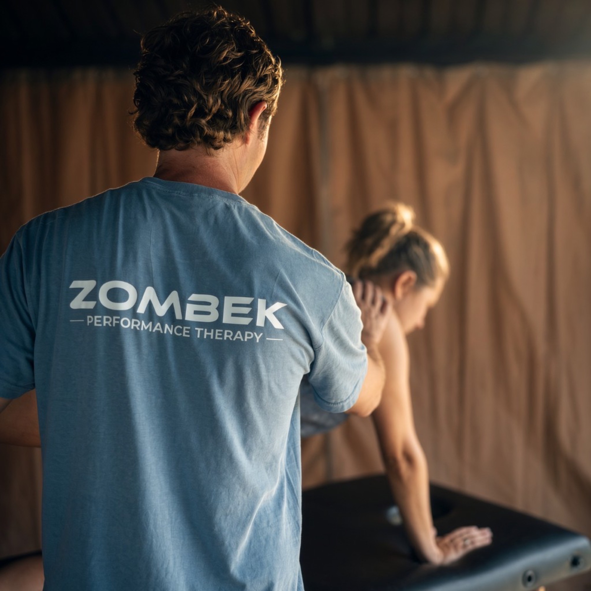 Dr. Zombek working with a patient at Zombek Performance Therapy